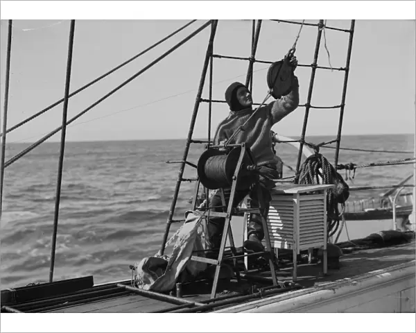 Dennis Lillie at the water bottle winch. January 1st 1911