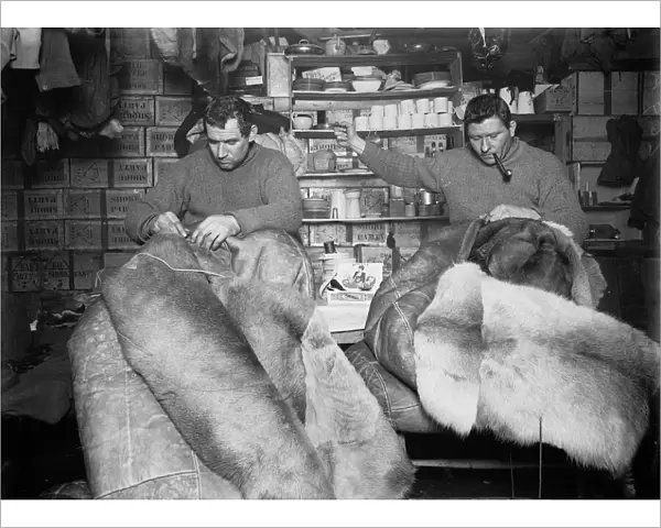 Edgar Evans and Tom Crean mending sleeping bags. May 16th 1911