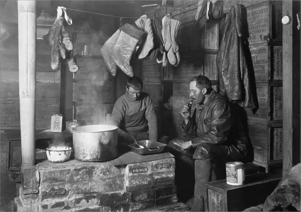 Cecil Meares and Dimitri Geroff at the blubber stove in the Discovery Hut at Hut Point. November 3rd 1911