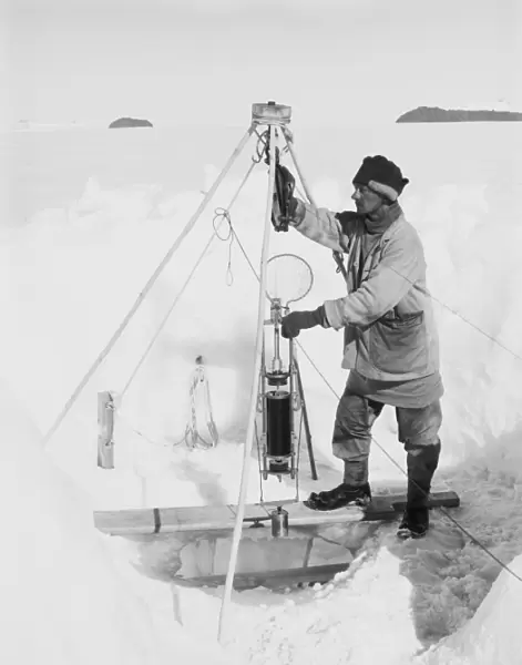 Nelson in his igloo with the Nansen-Petersson insulating water-bottle. December 24th 1911