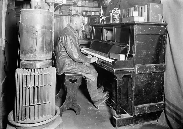 Cecil Meares at the pianola in the Winterquarters Hut. January 1912