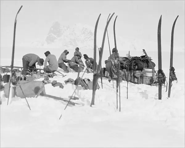 Foundering in soft snow: Bowers sledge team; Wilson pushing; Oates and PO Evans repairing