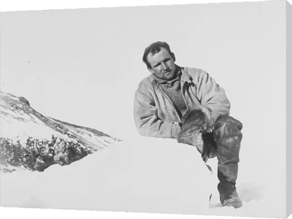 Raymond Priestley leaning on a lump of ice