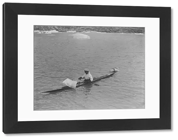 Jamesi in a kayak towing seal