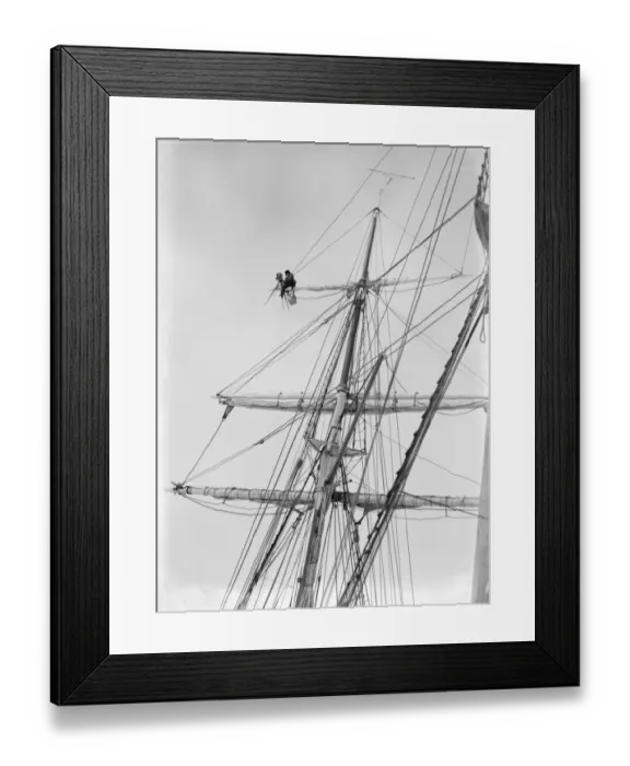 Framed Print : Frank Hurley taking film from aloft
