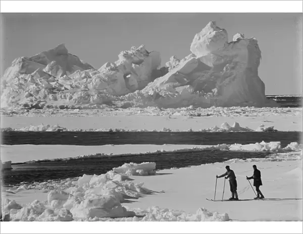 Iceberg in pack ice. Frank Debenham and T. Griffith Taylor on the ice. December 20th 1910