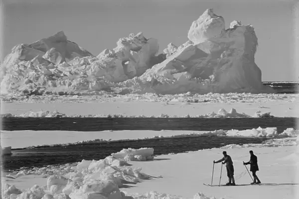 Iceberg in pack ice. Frank Debenham and T. Griffith Taylor on the ice. December 20th 1910