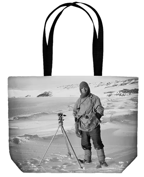 Lt Edward Evans and one of the sledging theodolites, (Barne Glacier in the background). October 1911