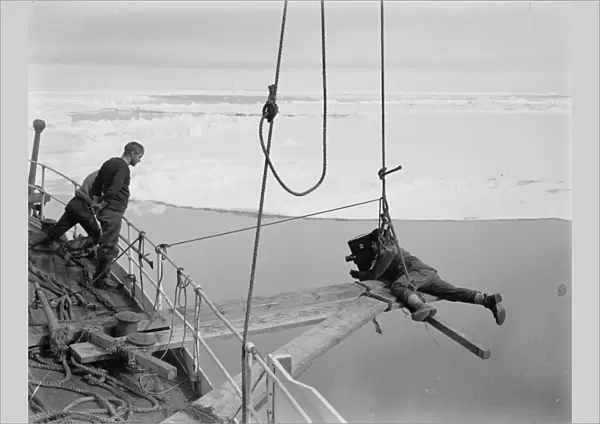 Ponting cinematographing the prow of the Terra Nova going through the pack ice. December 1910
