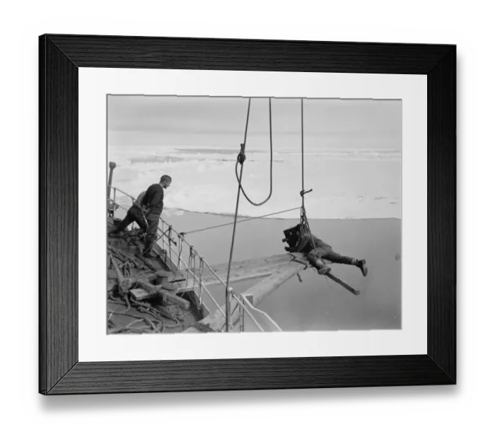 Framed Print : Ponting cinematographing the prow of the Terra Nova going through the pack ice. December 1910 Framed Print : Ponting cinematographing the prow of the Terra Nova going through the pack ice. December 1910