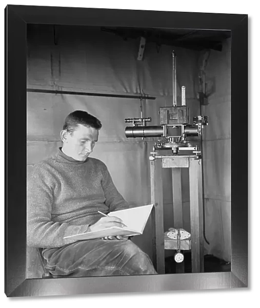 Dr Simpson at work in the Magnetic Hut at Winterquarters. January 5th 1911