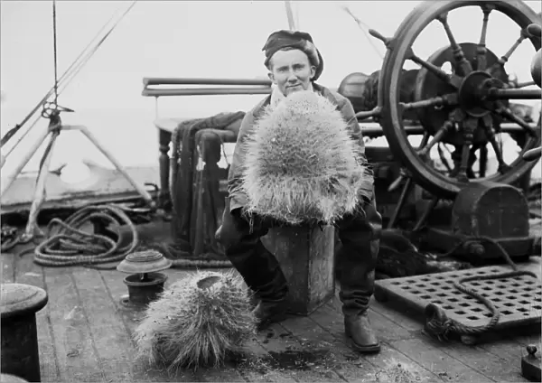 Dennis Lillie with a glass sponge on deck of the ship Terra Nova