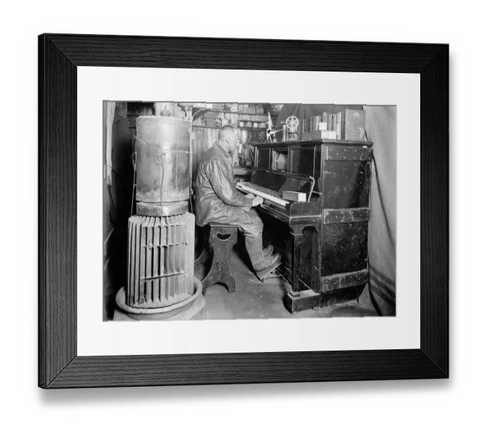 Framed Print : Cecil Meares at the pianola in the Winterquarters Hut. January 1912