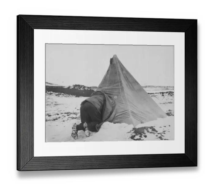 Framed Print : Dr Edward Wilson entering his tent at Cape Royds