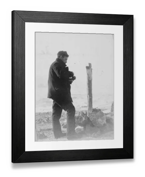 Framed Print : Post office, Possession Island. A man places contents inside a canister Framed Print : Post office, Possession Island. A man places contents inside a canister