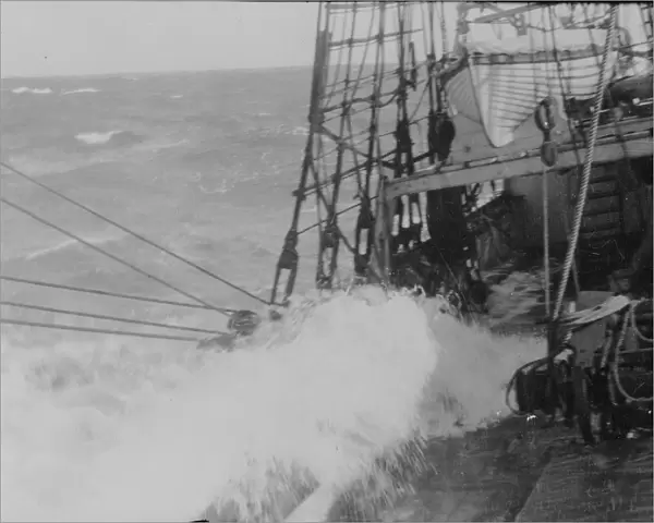 Heavy weather. Waves washing over the deck of the ship