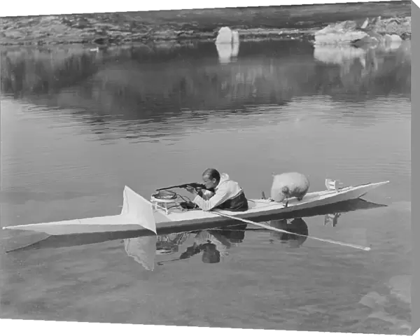 H. G. (Gino) Watkins shooting from kayak