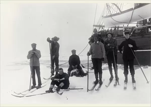 Group of officers on floe alongside ship in pack ice