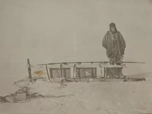 Adams standing by the sledge which was used on the furthest south journey