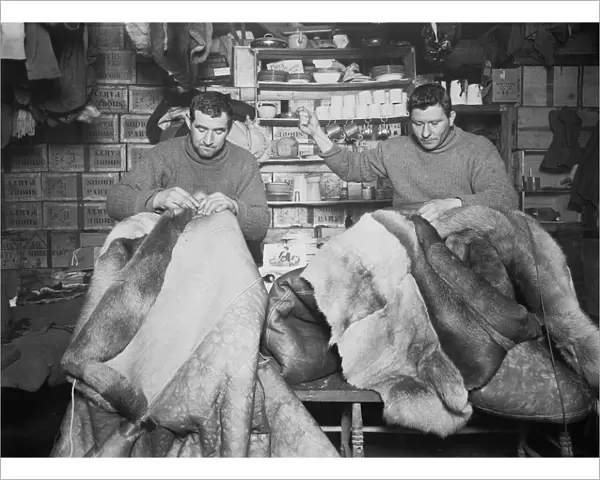 Petty Officers Evans and Crean mending sleeping bags