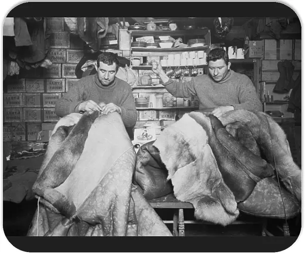 Petty Officers Evans and Crean mending sleeping bags