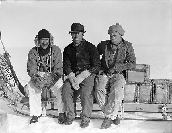 Lindsay, Scott and Stephenson, sitting on sledge, Ivigtut journey