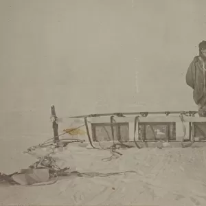 Adams standing by the sledge which was used on the furthest south journey