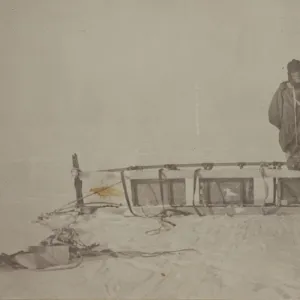 Adams standing by the sledge which was used on the furthest south journey