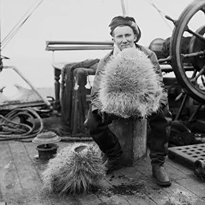 Dennis Lillie with a glass sponge on deck of the ship Terra Nova