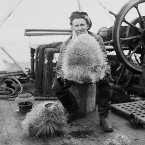 Dennis Lillie with a glass sponge on deck of the ship Terra Nova