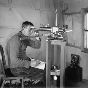 Dr Simpson at work in the Magnetic Hut at Winterquarters. January 5th 1911 Dr Simpson at work in the Magnetic Hut at Winterquarters. January 5th 1911