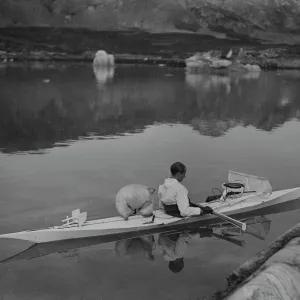 H. G. (Gino) Watkins in kayak among ice floes