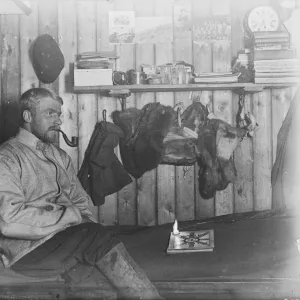 Harry Dickason, sitting on his bunk