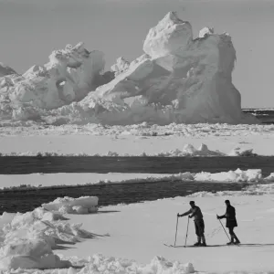 Iceberg in pack ice. Frank Debenham and T. Griffith Taylor on the ice. December 20th 1910