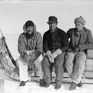 Lindsay, Scott and Stephenson, sitting on sledge, Ivigtut journey