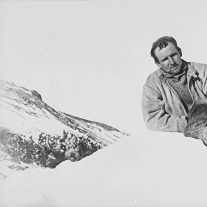 Raymond Priestley leaning on a lump of ice