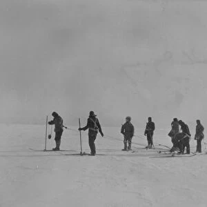 Sledging, eight men man-hauling a sledge