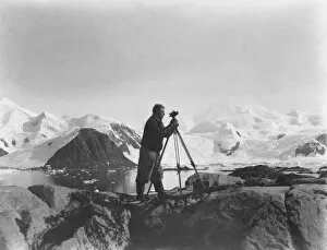 British Graham Land Expedition 1934-37 Gallery: Alfred Stephenson with theodolite, Anchorage Island