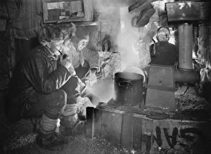 British Antarctic Expedition 1910-13 (Terra Nova) Collection: Cecil Meares and Capt Oates at the blubber stove, cooking food for the dogs. May 26th 1911
