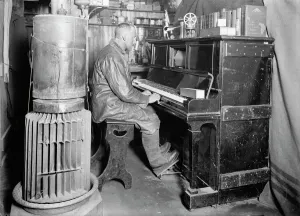 Cecil Meares at the pianola in the Winterquarters Hut. January 1912 Cecil Meares at the pianola in the Winterquarters Hut. January 1912