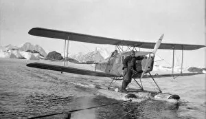 Antarctic Peninsula Collection: Debenham Islands, plane being towed on floats, April 1936