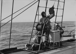 British Antarctic Expedition 1910-13 (Terra Nova) Gallery: Dennis Lillie at the water bottle winch. January 1st 1911