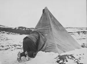 Antarctic Relief Expeditions 1902-04 Gallery: Dr Edward Wilson entering his tent at Cape Royds