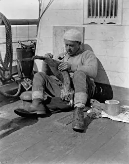 British Antarctic Expedition 1910-13 (Terra Nova) Collection: Dr Levick skinning a penguin in the Terra Nova