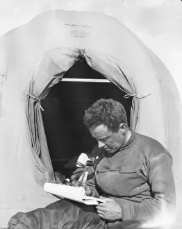British Antarctic Expedition 1910-13 (Terra Nova) Collection: George Murray Levick sitting at entrance to a tent
