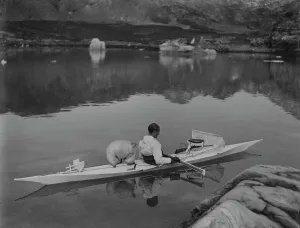H. G. (Gino) Watkins in kayak among ice floes