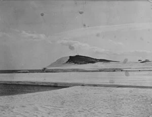Antarctic Relief Expeditions 1902-04 Collection: Hut Point Discovery Winter Quarters. Showing memorial cross for Vince