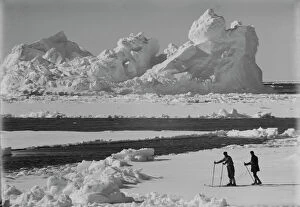 British Antarctic Expedition 1910-13 (Terra Nova) Collection: Iceberg in pack ice. Frank Debenham and T. Griffith Taylor on the ice. December 20th 1910