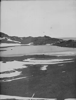 Antarctic Relief Expeditions 1902-04 Collection: Lake on Cape Royds, Capt Colbeck and party in distance