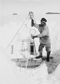British Antarctic Expedition 1910-13 (Terra Nova) Gallery: Nelson in his igloo with the Nansen-Petersson insulating water-bottle. December 24th 1911